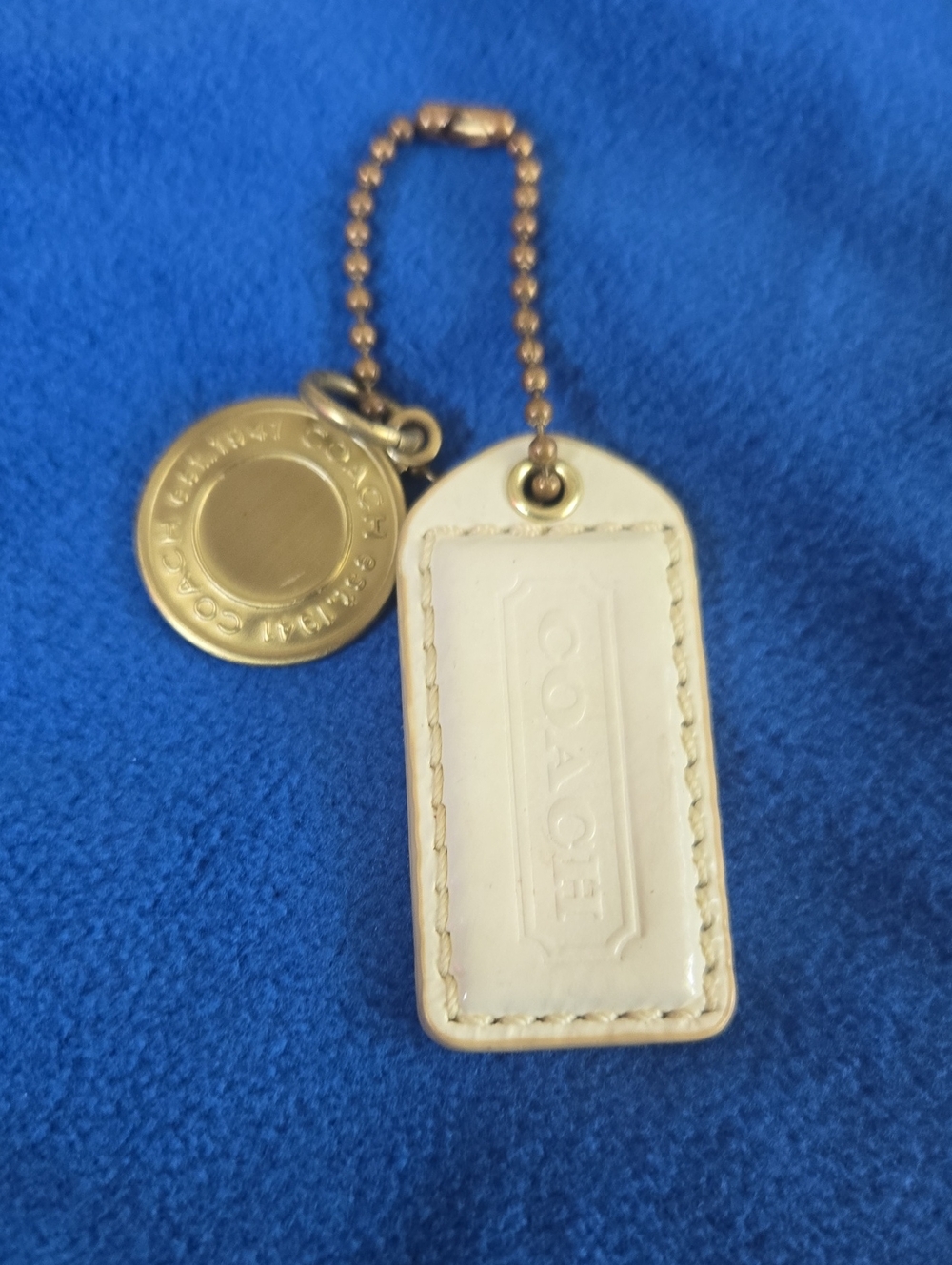 Coach Cream Leather Hangtag with Gold Medallion